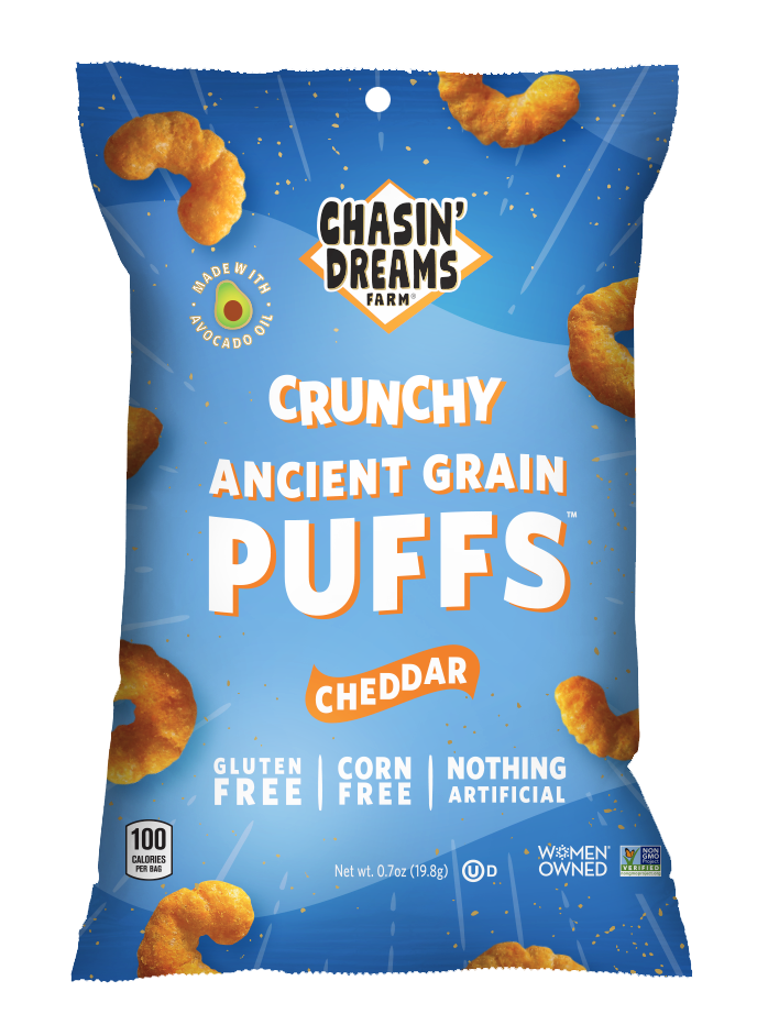 Chasin&#39; Dreams Farm Crunchy Ancient Grain Cheddar Puffs 0.7oz bag. Blue back with white lines and speckles, orange puffs around the border.