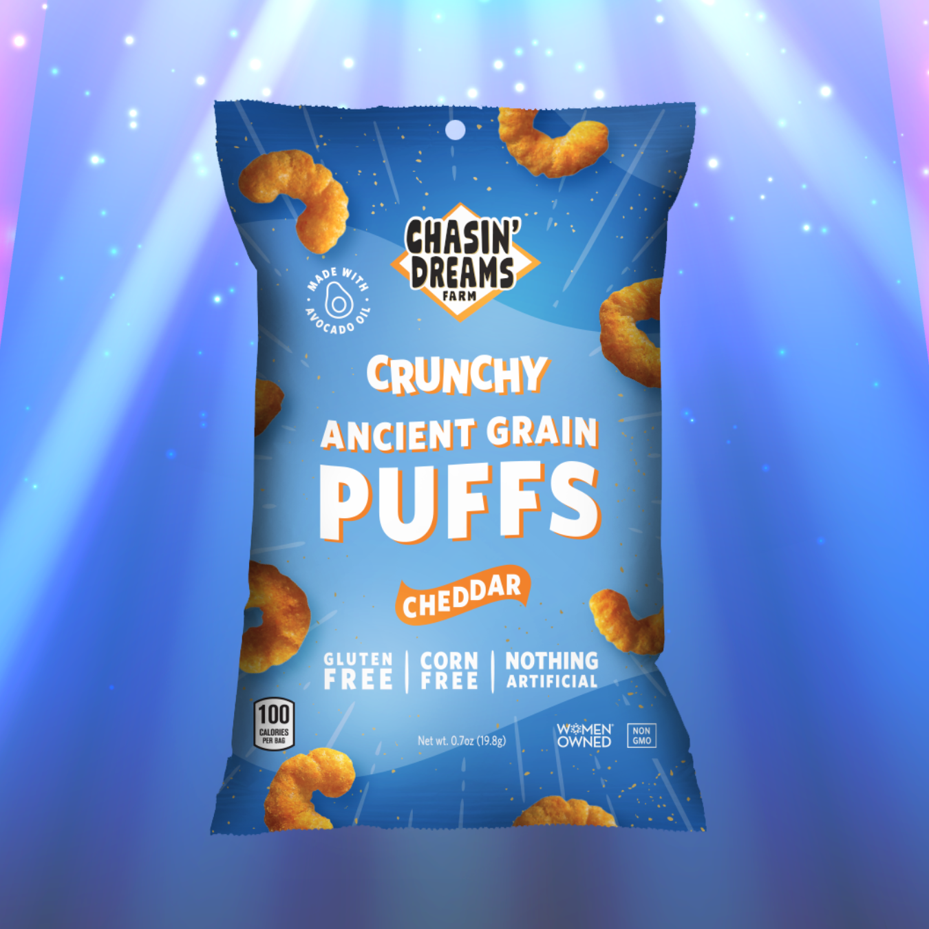 Blue bag of Crunchy Ancient Grain Puffs : Cheddar. Orange puffs on the bag on a blue background with a spotlight.