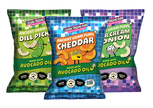 
Three snack packs of puffed ancient grains in the flavors: Cheddar, Dill Pickle, and Sour Cream and Onion on a transparent background