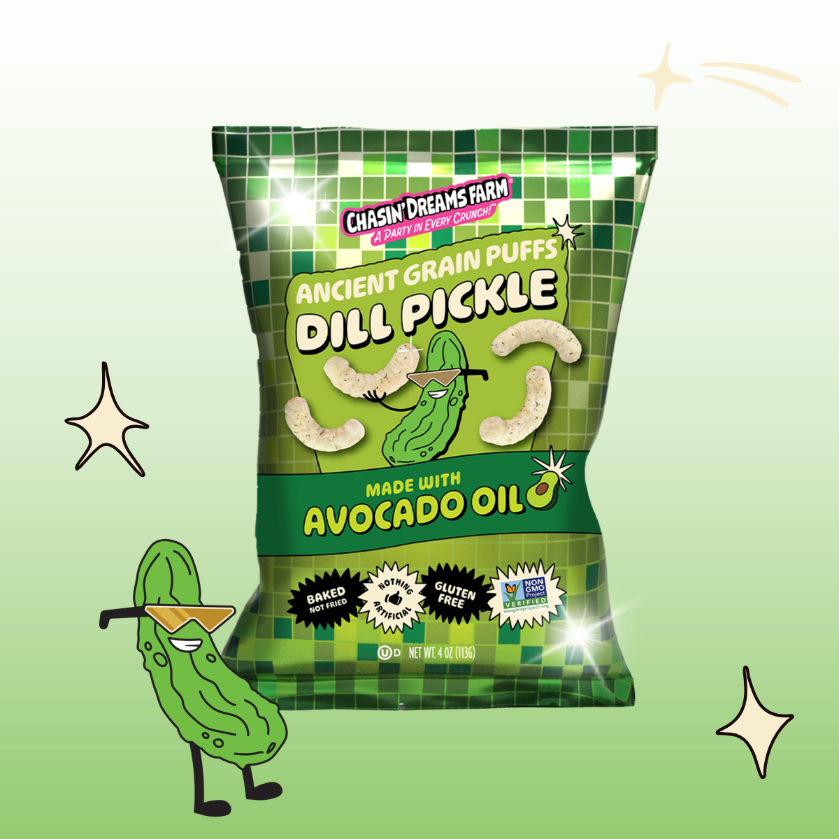 A bag of Chasin’ Dreams Farm Dill Pickle Ancient Grain Puffs made with avocado oil — gluten-free, non-GMO, no seed oils, and baked not fried. Characterized by a green and white color scheme with cartoon pickle character and sparkles.