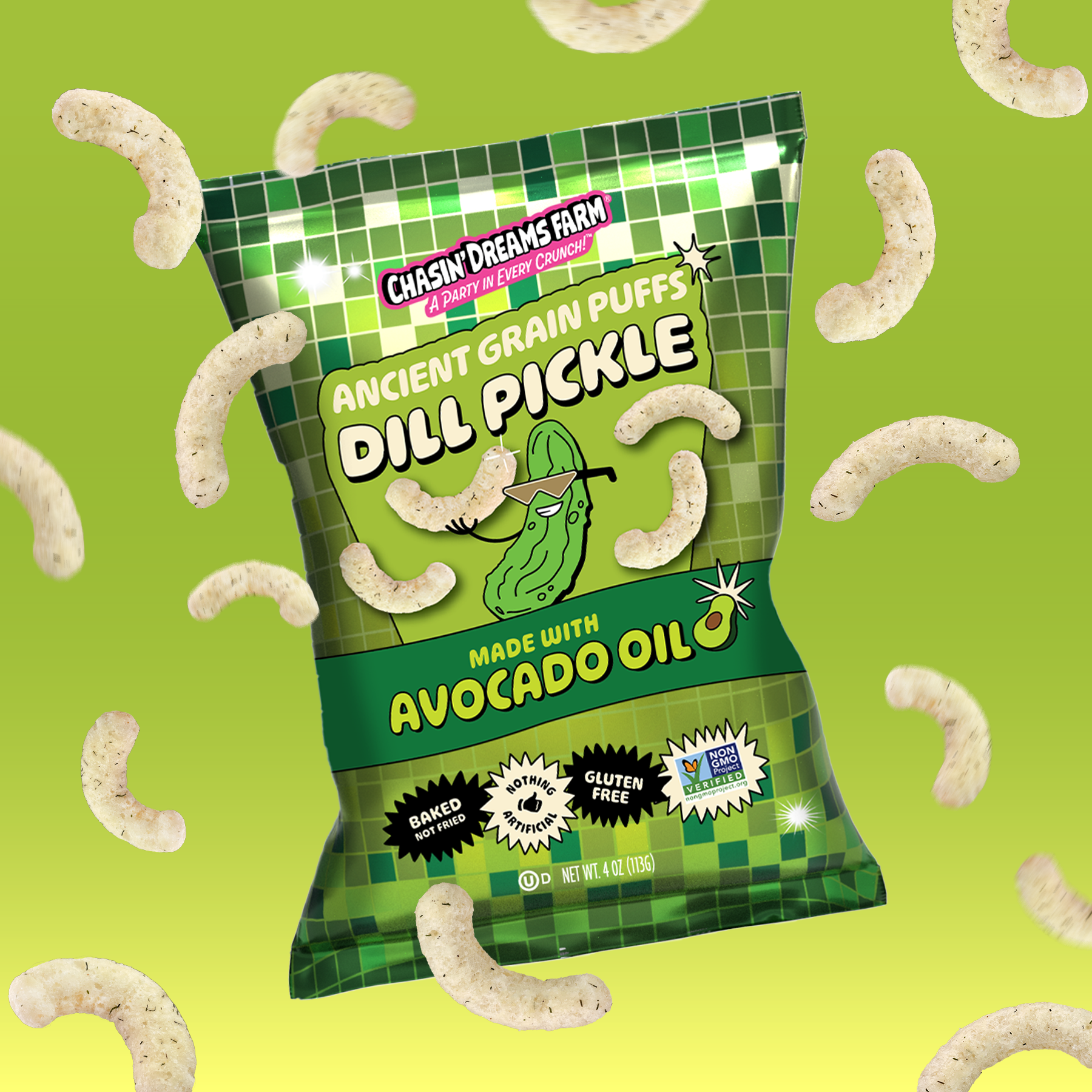 A bag of Chasin’ Dreams Farm Dill Pickle Ancient Grain Puffs made with avocado oil — gluten-free, non-GMO, no seed oils, and baked not fried. Characterized by a green and white color scheme with puffs flying around.