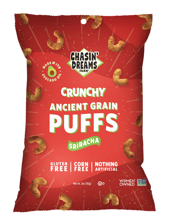Chasin&#39; Dreams Farm Crunchy Ancient Grain Sriracha Puffs 3oz. Red bag with white stripes and speckles. Orange puffs around the border.
