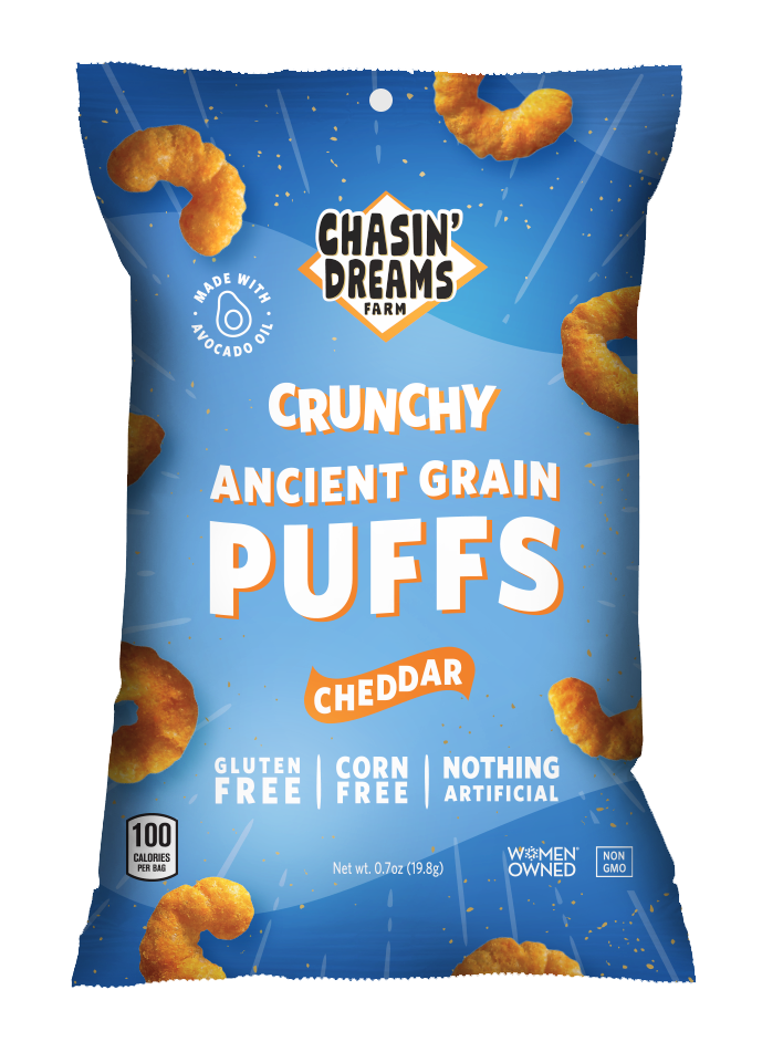 Chasin&#39; Dreams Farm Crunchy Ancient Grain Cheddar Puffs 0.7oz. Blue bag with white stripes and orange puffs on the border.